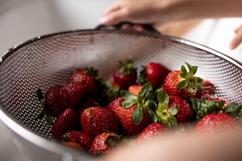 Strawberries in a colander.