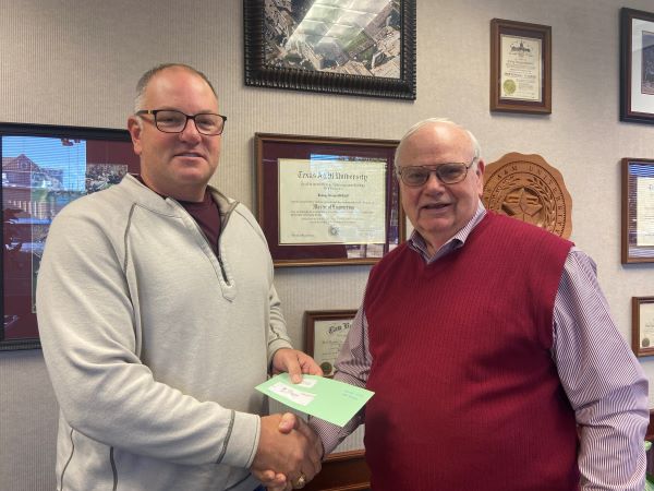 From left is Brad Luedke, CFC Bryan relationship manager, and Jimmy McCord.